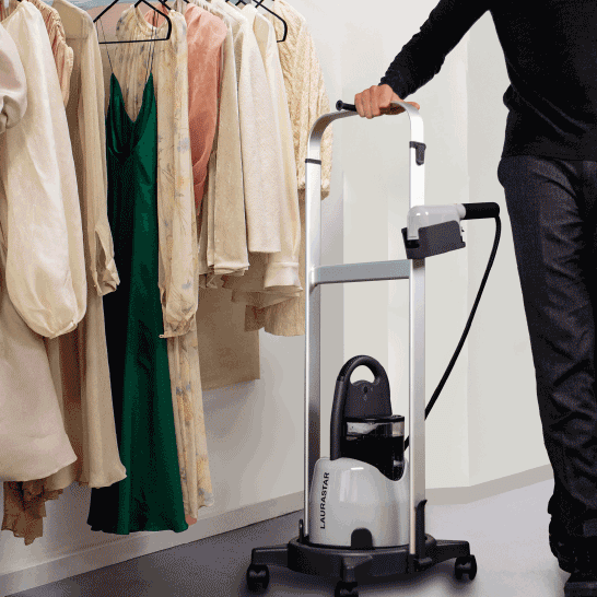 IZZI garment steamer in action beautifying multiple clothing items